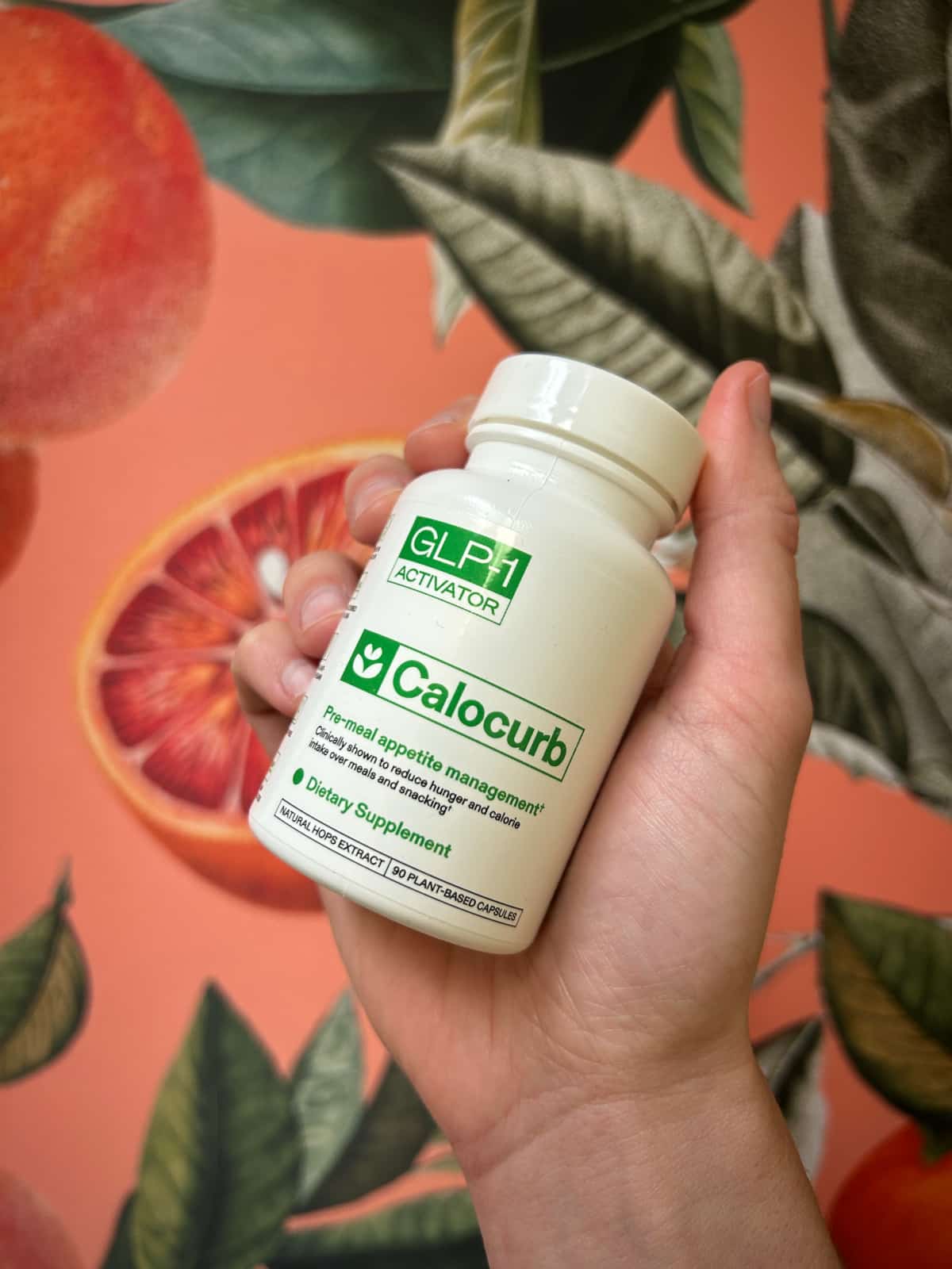 photo of Calocurb bottle in front of colorful picture